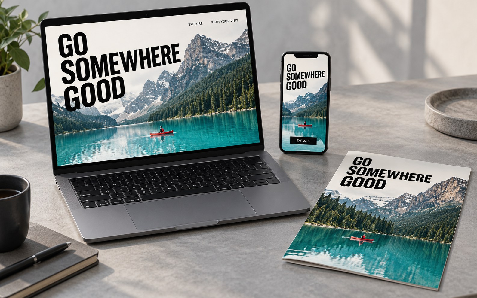 Original Go Somewhere Good travel concept coordinated across laptop, phone and printed brochure